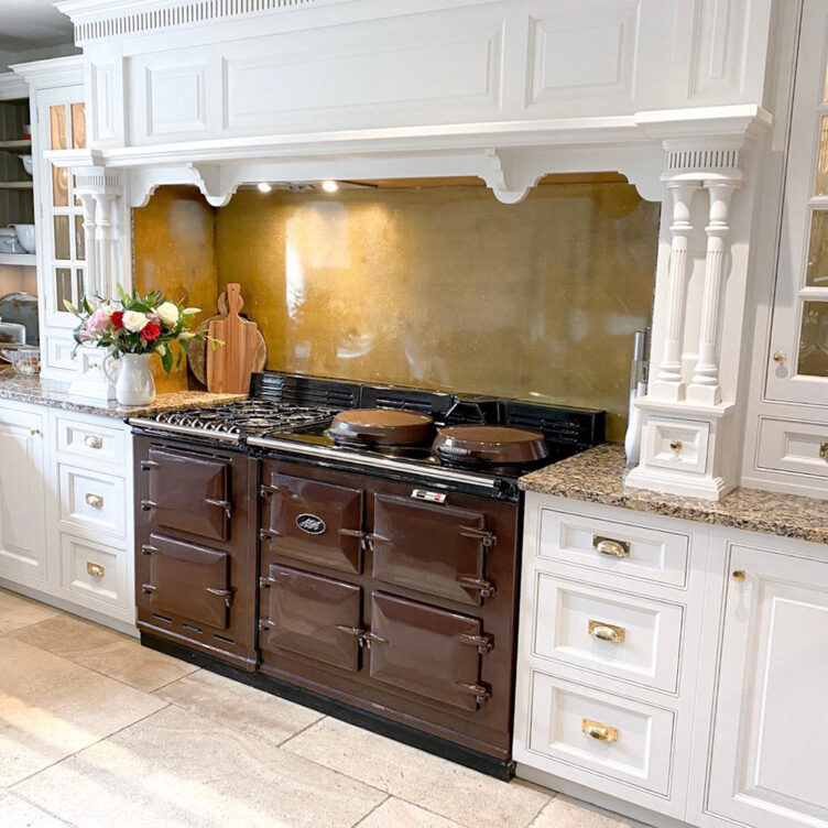 antiqued brass splashback behind AGA