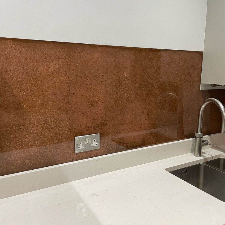 Aged copper kitchen splashback with gloss finish