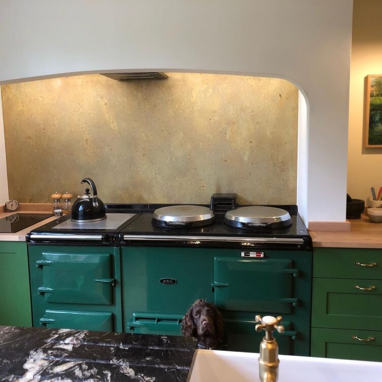 aged brass splashback behind aga