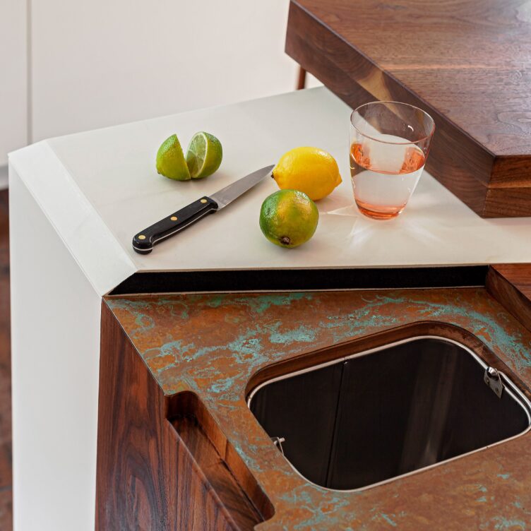aged copper kitchen worktop with cutout for garbage disposal