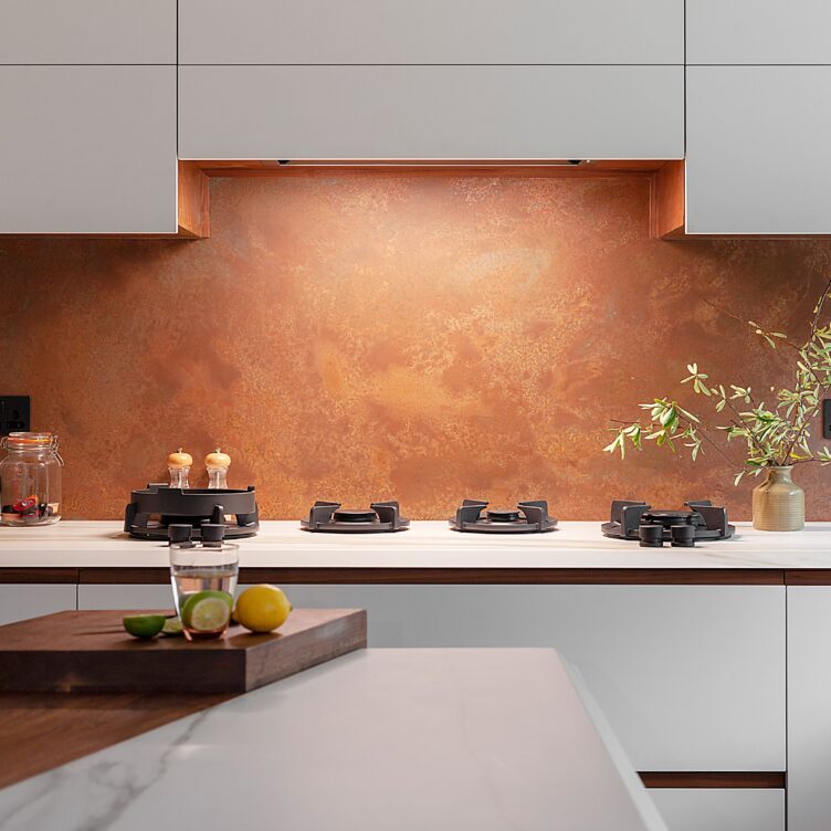 copper splashback with cutouts for plug sockets