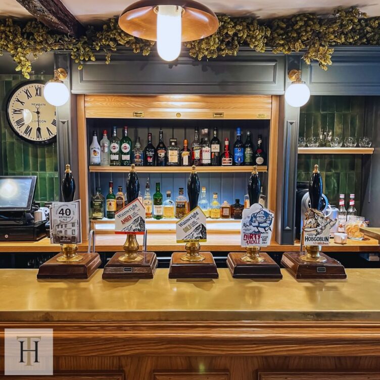 a bespoke brass bar top in The Kings Arms Hotel bar in Keswick, Cumbria