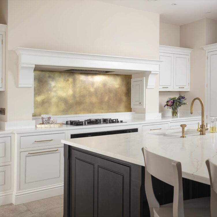 brass patina backsplash in white kitchen